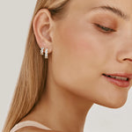 Load image into Gallery viewer, Blue Topaz Huggies
